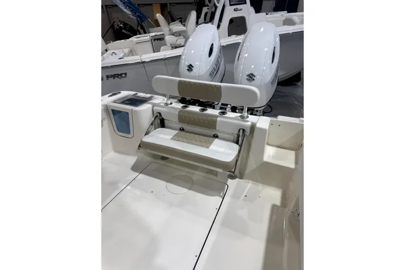 Slide: The Image of 2024 Bulls Bay 255 Center Console boat with dual Suzuki engines and seating area. - 10