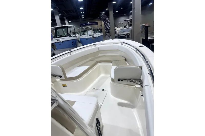Slide: The Image of 2024 Bulls Bay 255 Center Console boat interior at a showroom display. - 5