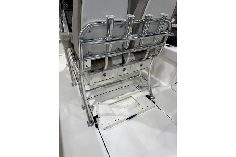 Slide: The Image of 2024 Bulls Bay 255 Center Console boat interior with rod holders and storage compartments. - 9