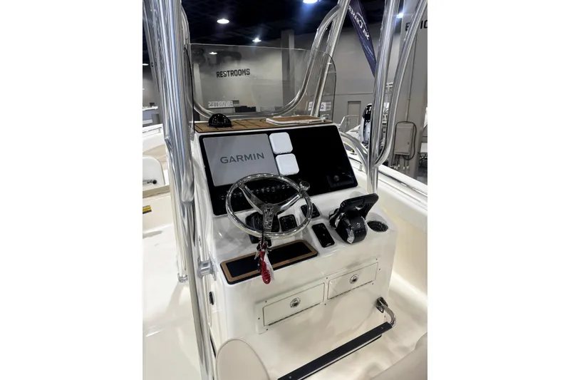Slide: The Image of 2024 Bulls Bay 255 Center Console boat with Garmin navigation system at helm. - 3