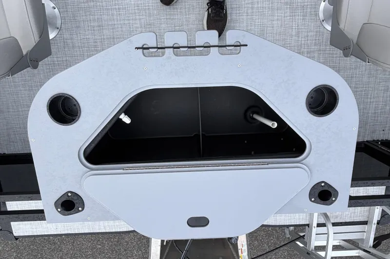 Slide: The Image of Dockside 20DF 2026 boat interior with storage compartment and cup holders. - 12