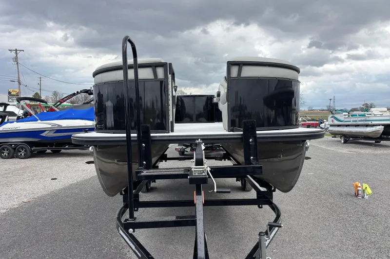 Slide: The Image of 2026 Dockside 20DF pontoon boat on trailer under cloudy sky. - 2