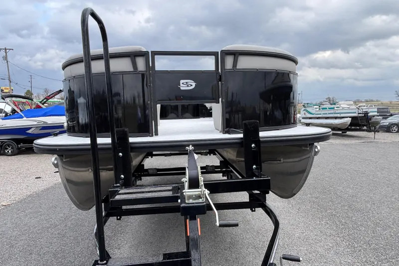 Slide: The Image of 2026 Dockside 20DF pontoon boat on trailer under cloudy sky. - 6