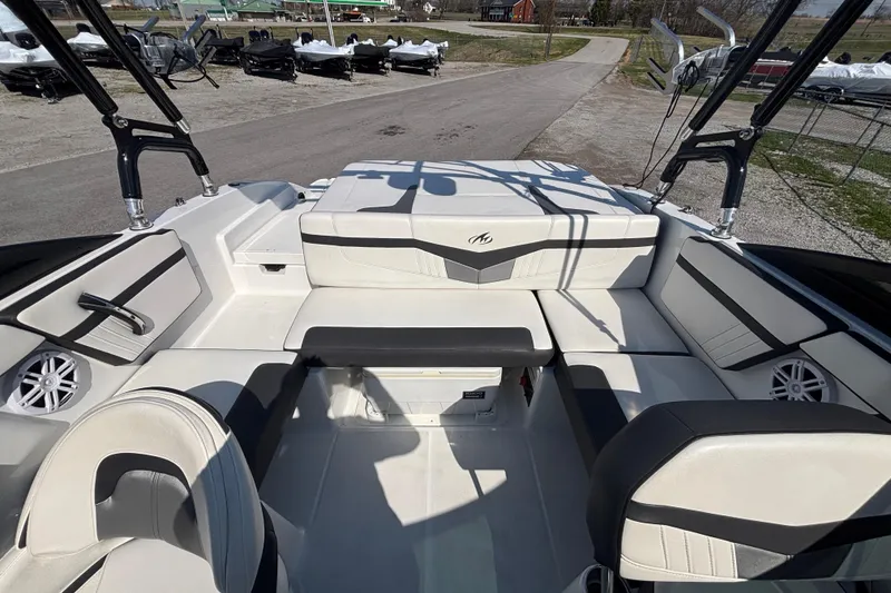 Slide: The Image of 2021 Monterey M-22 boat interior with white seating and modern design. - 11