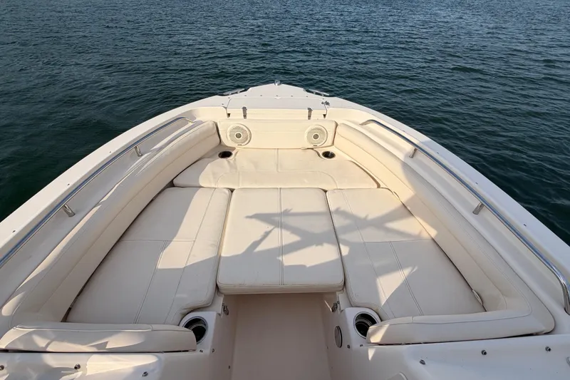 Slide: The Image of 2017 Grady-White Freedom 225 boat with spacious seating on calm water. - 12