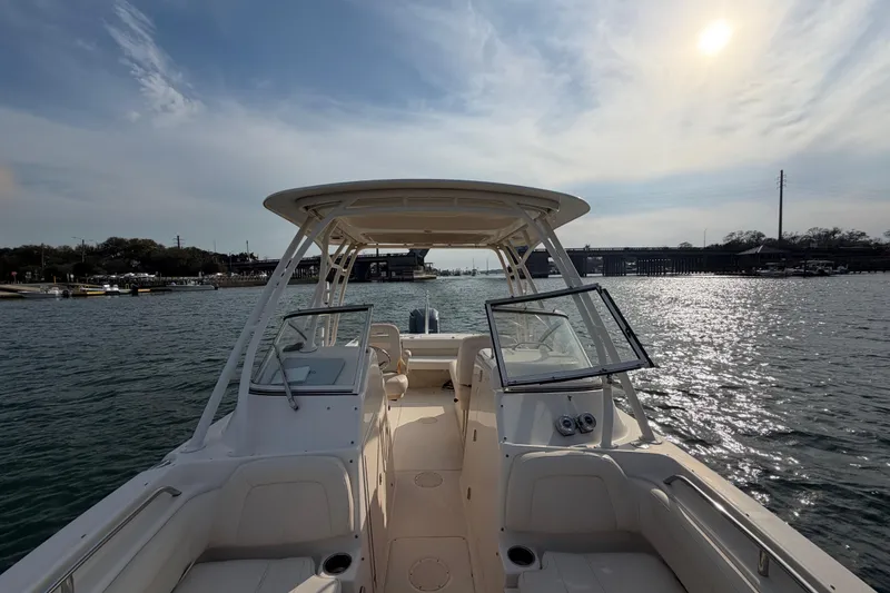 Slide: The Image of 2017 Grady-White Freedom 225 boat on water under a sunny sky. - 15