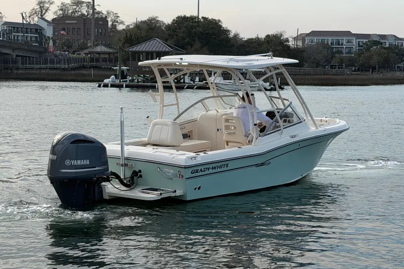 Slide: The Image of 2017 Grady-White Freedom 225 boat cruising on calm water with Yamaha engine. - 2
