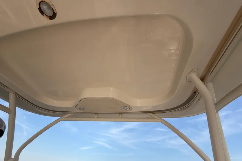 Slide: The Image of 2017 Grady-White Freedom 225 boat canopy with clear sky background. - 20