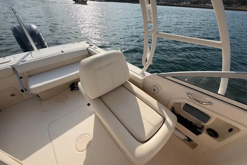 Slide: The Image of 2017 Grady-White Freedom 225 boat interior with seating and water view. - 27