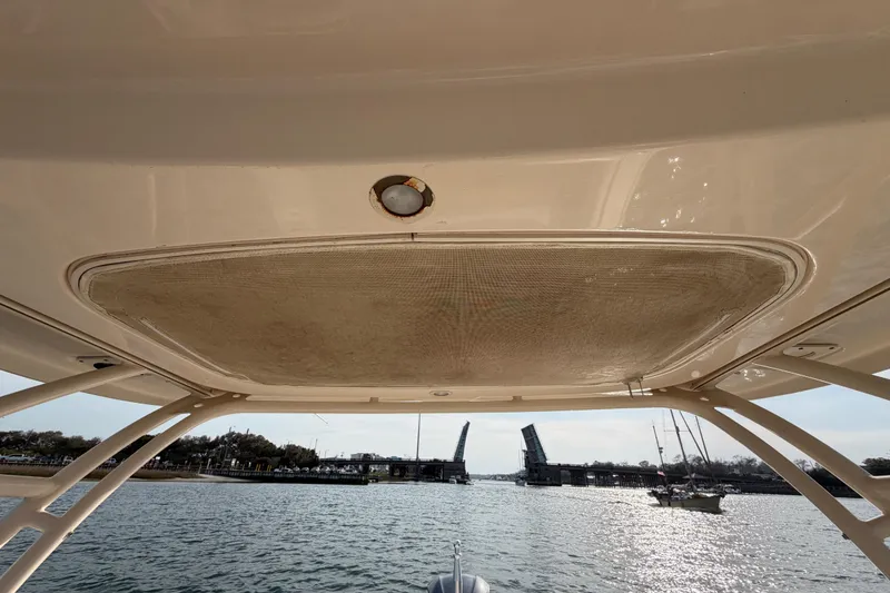 Slide: The Image of 2017 Grady-White Freedom 225 boat under bridge, sunny day, calm waters. - 28