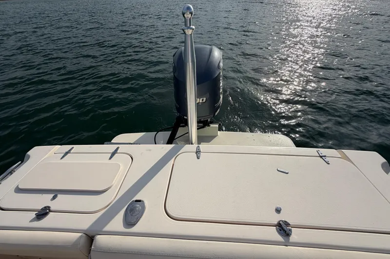 Slide: The Image of 2017 Grady-White Freedom 225 boat with outboard motor on calm water. - 31
