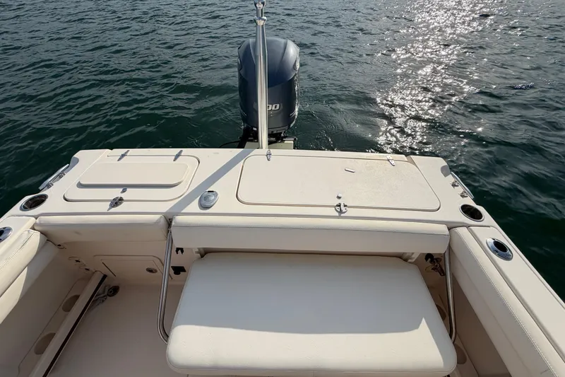 Slide: The Image of 2017 Grady-White Freedom 225 boat with outboard motor on calm water. - 37
