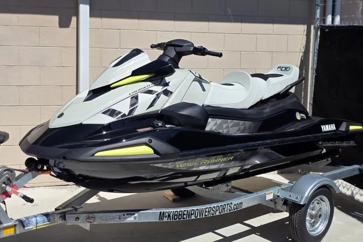 The Image of 2026 Yamaha WaveRunner VX Cruiser HO on trailer, sleek design, parked outdoors. - 1