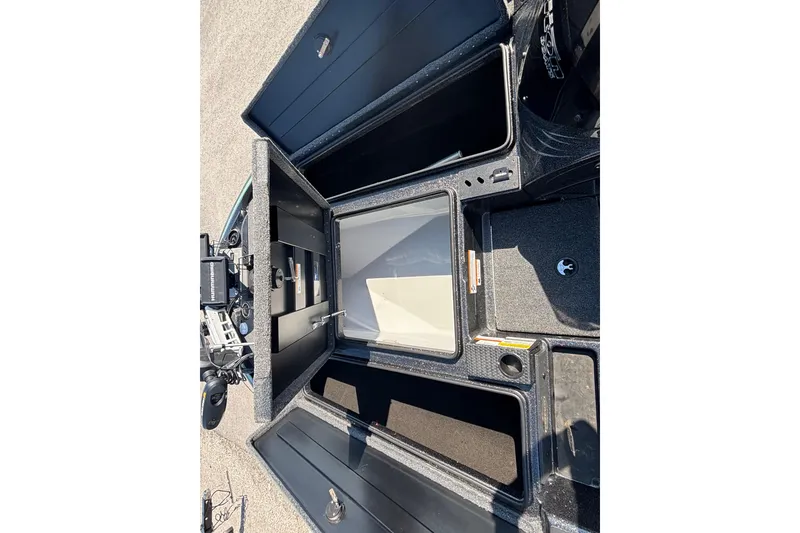 Slide: The Image of 2020 Triton 189 TrX boat storage compartments open, showcasing interior space and organization. - 11
