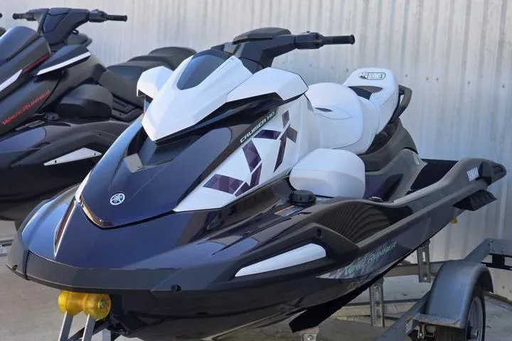 The Image of 2026 Yamaha WaveRunner VX Cruiser HO on trailer, sleek design, white and black color scheme. - 1