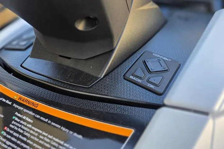 Slide: The Image of 2026 Yamaha WaveRunner VX Cruiser HO dashboard controls with warning label. - 11