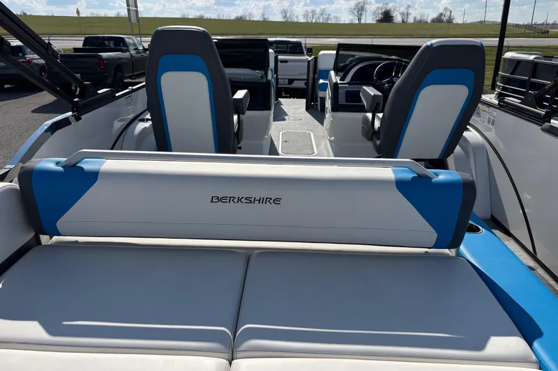 Slide: The Image of 2025 Berkshire 25UL DC STS boat interior with blue and white seating. - 11