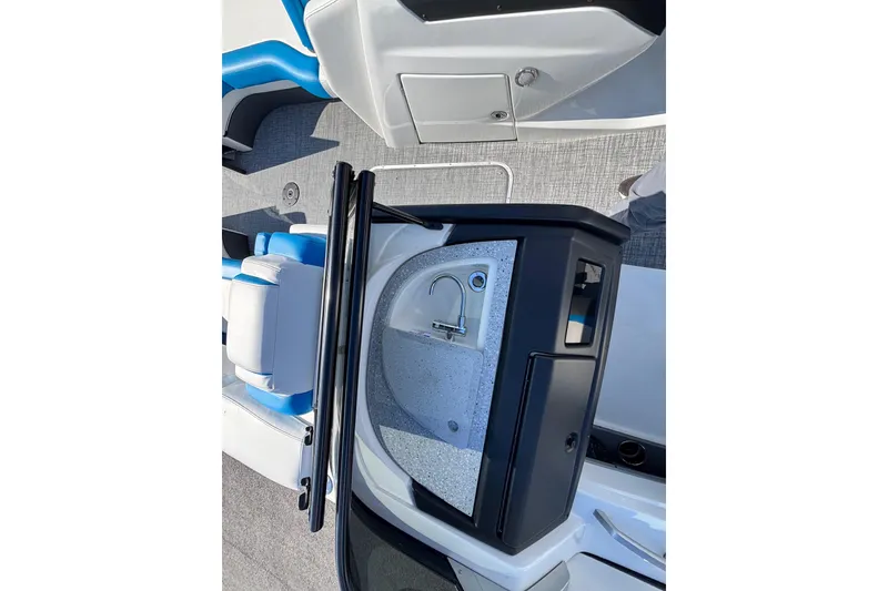 Slide: The Image of 2025 Berkshire 25UL DC STS boat interior with sink and seating area. - 6