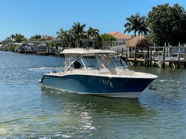The Image of 2021 Grady-White 325 Freedom boat on calm waters. - 0