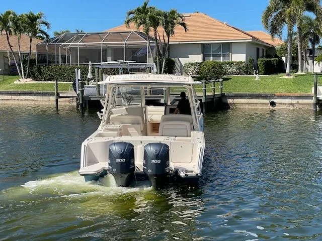 Slide: The Image of Grady-White 325 Freedom boat on water, 2021 model. - 2