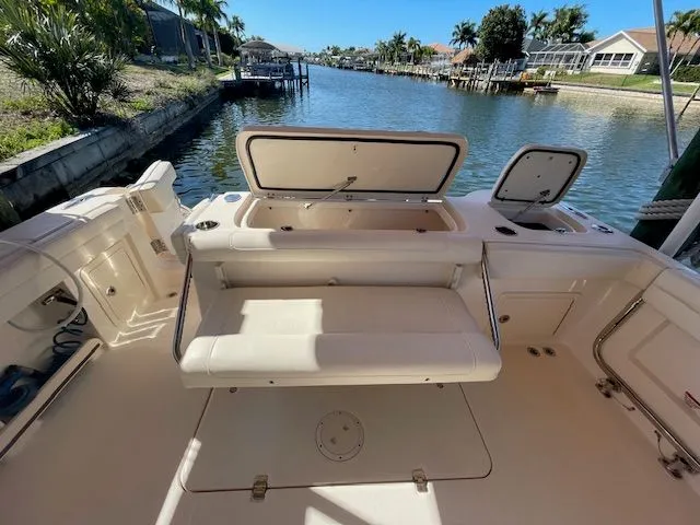 Slide: The Image of 2021 Grady-White 325 Freedom boat deck with seating and storage. - 21