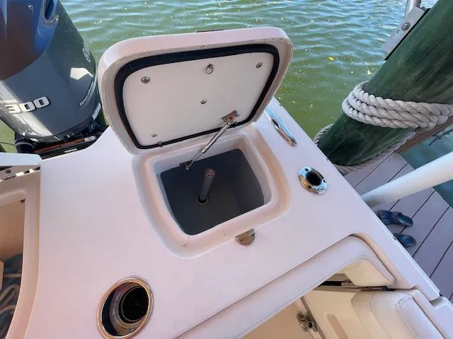 Slide: The Image of Grady-White 325 Freedom 2021 boat with open storage compartment lid. - 23