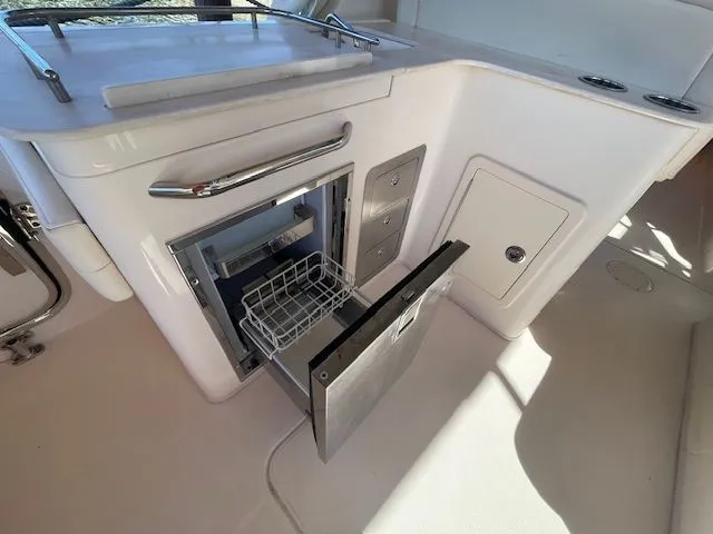 Slide: The Image of Open cooler on Grady-White 325 Freedom boat, year 2021. - 25