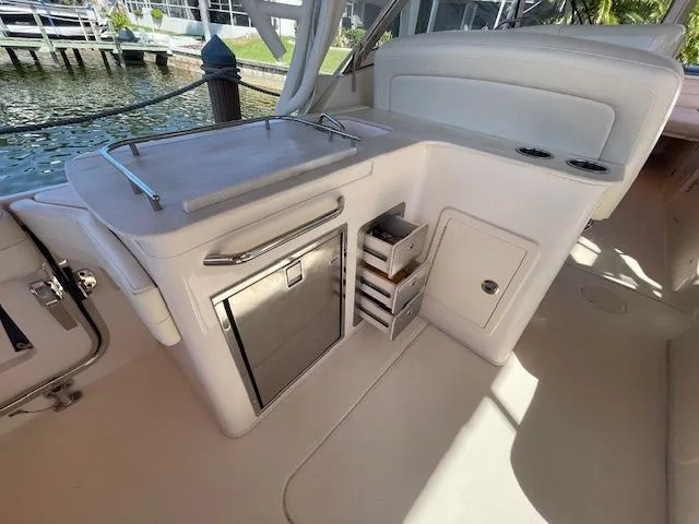 Slide: The Image of Interior of 2021 Grady-White 325 Freedom with fridge and storage. - 26
