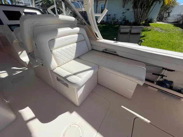 Slide: The Image of Interior of a 2021 Grady-White 325 Freedom boat with luxurious seating. - 28
