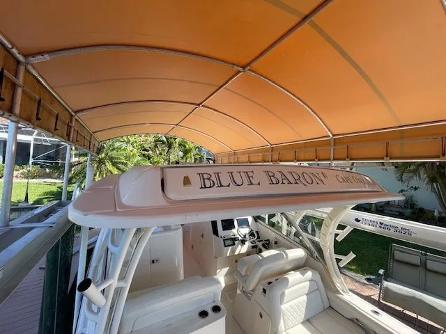 Slide: The Image of Grady-White 325 Freedom boat under orange canopy, 2021 model. - 30