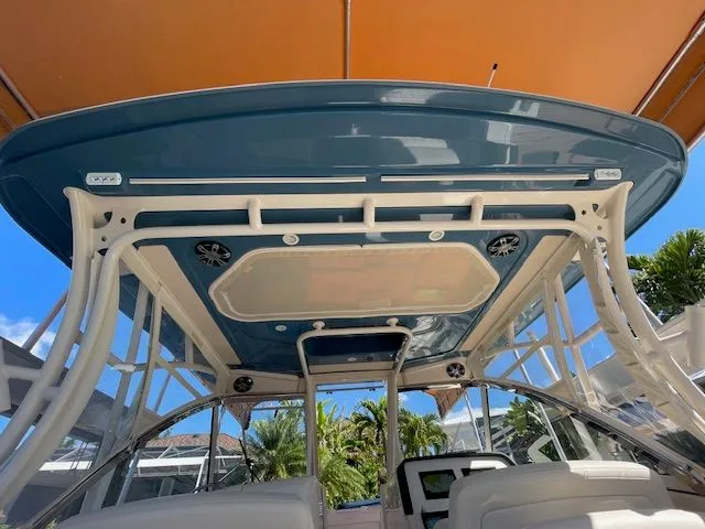 Slide: The Image of 2021 Grady-White 325 Freedom boat with canopy and seating area. - 34