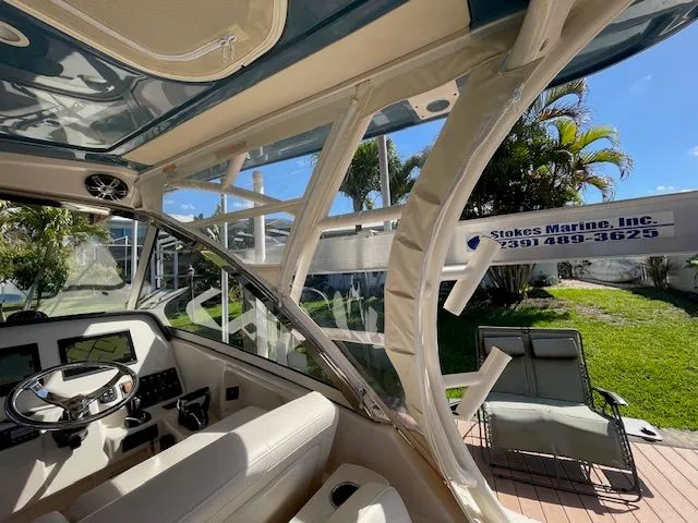 Slide: The Image of Interior view of a 2021 Grady-White 325 Freedom boat with helm. - 39