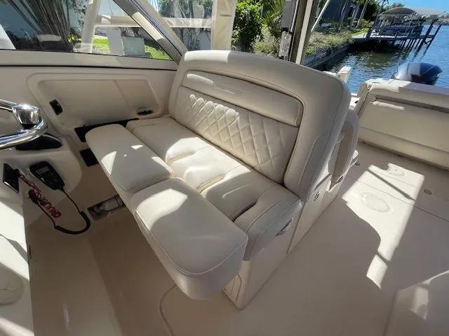 Slide: The Image of Interior of a 2021 Grady-White 325 Freedom boat with luxurious seating. - 41