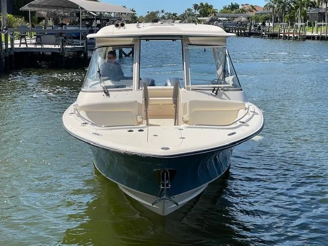 Slide: The Image of Grady-White 325 Freedom 2021 boat on calm water. - 6