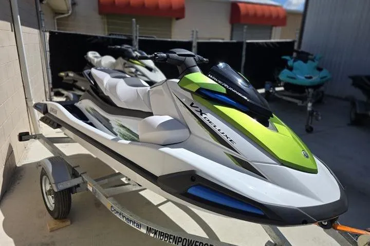 Slide: The Image of 2026 Yamaha WaveRunner VX Deluxe in vibrant green and white on a trailer. - 10