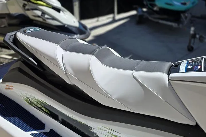 Slide: The Image of 2026 Yamaha WaveRunner VX Deluxe seat, sleek design, comfortable padding, outdoor setting. - 11