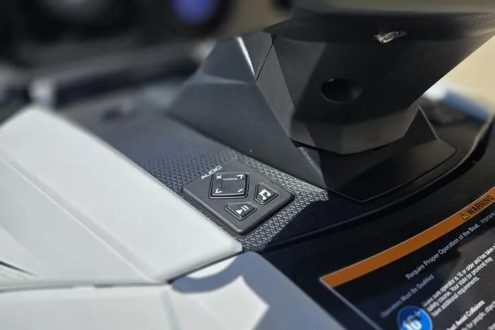 Slide: The Image of 2026 Yamaha WaveRunner VX Deluxe dashboard with audio controls and warning label. - 16