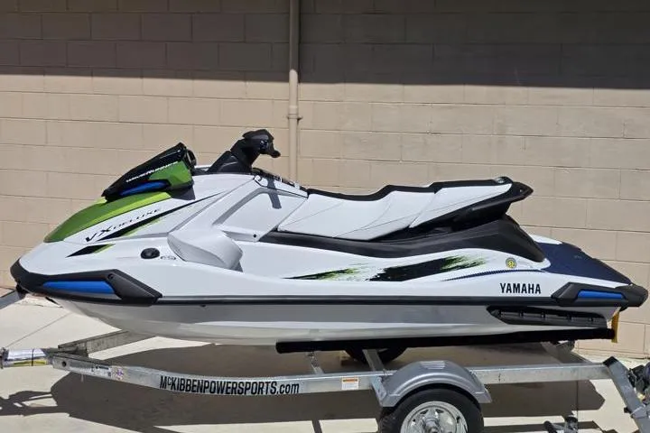 Slide: The Image of 2026 Yamaha WaveRunner VX Deluxe on trailer, sleek design, white and green accents. - 4