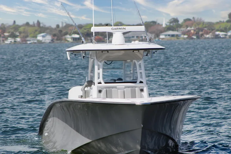 Slide: The Image of 2024 Cape Horn 39 T boat on water, featuring sleek design and advanced Garmin technology. - 2