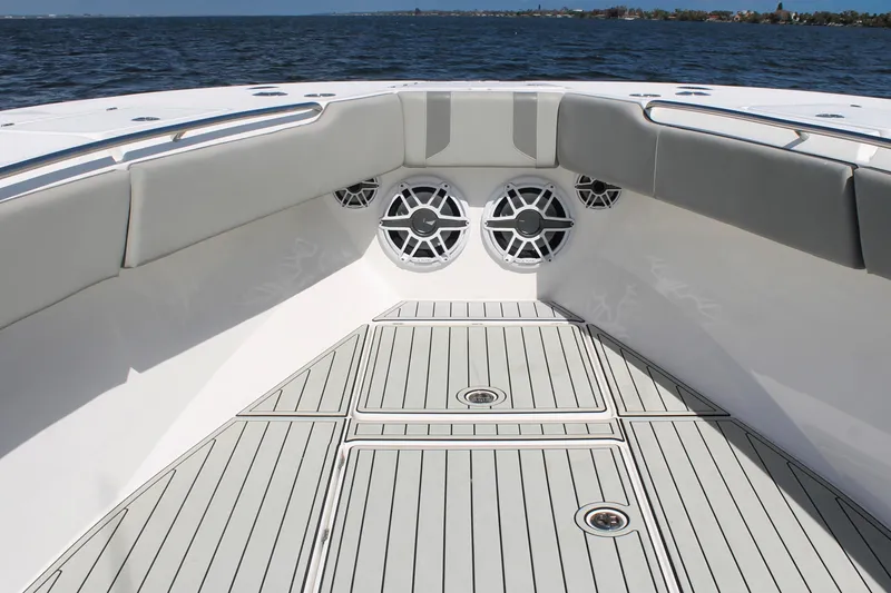 Slide: The Image of 2024 Cape Horn 39 T boat interior with cushioned seating and marine speakers. - 26