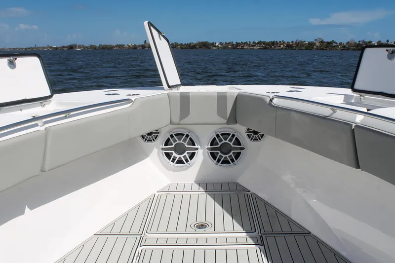 Slide: The Image of 2024 Cape Horn 39 T boat interior with cushioned seating and ocean view. - 27