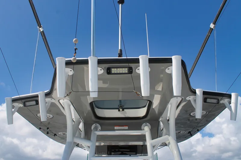 Slide: The Image of 2024 Cape Horn 39 T boat roof with fishing rod holders against blue sky. - 28
