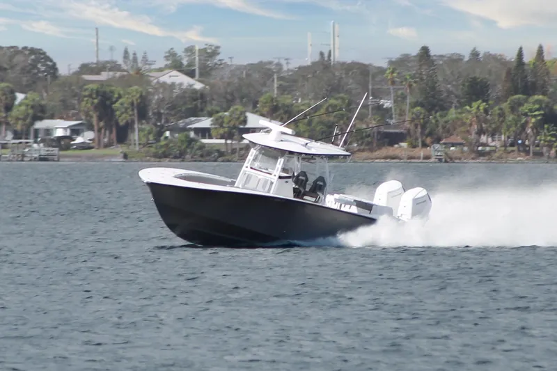 Slide: The Image of 2024 Cape Horn 39 T boat speeding on water near a coastal area. - 33