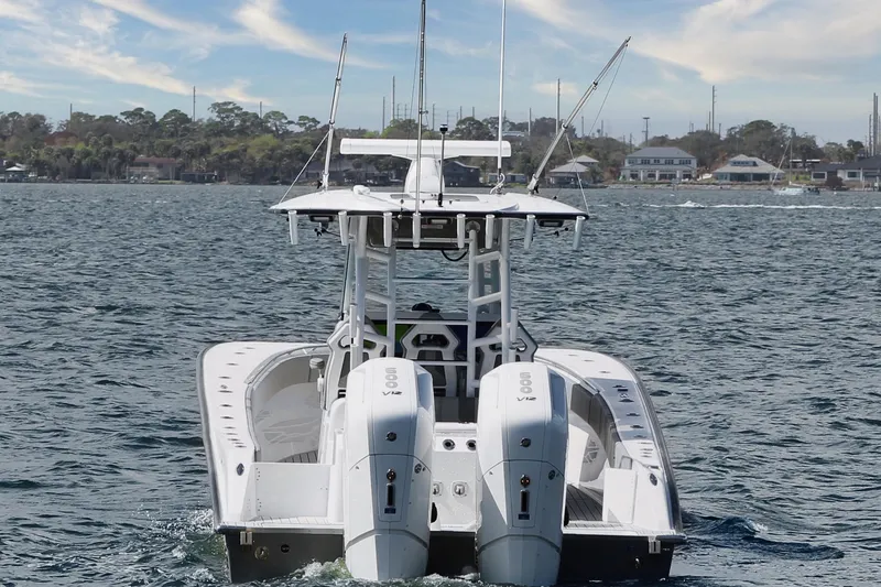 Slide: The Image of 2024 Cape Horn 39 T boat with dual engines cruising on a scenic waterway. - 5