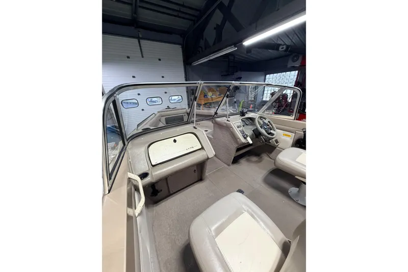 Slide: The Image of Interior view of 2000 Lund 1850 Tyee Gran Sport boat, featuring carpeted flooring. - 19
