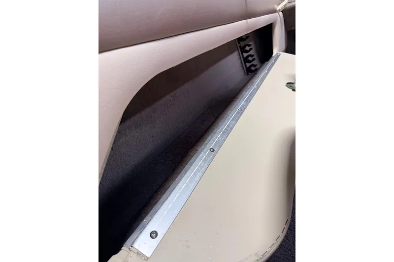 Slide: The Image of Interior view of a 2000 Lund 1850 Tyee Gran Sport boat, featuring seating and storage compartments. - 21