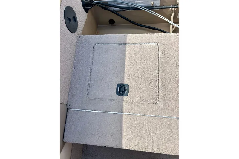 Slide: The Image of Carpeted storage compartment on a 2000 Lund 1850 Tyee Gran Sport boat. - 24