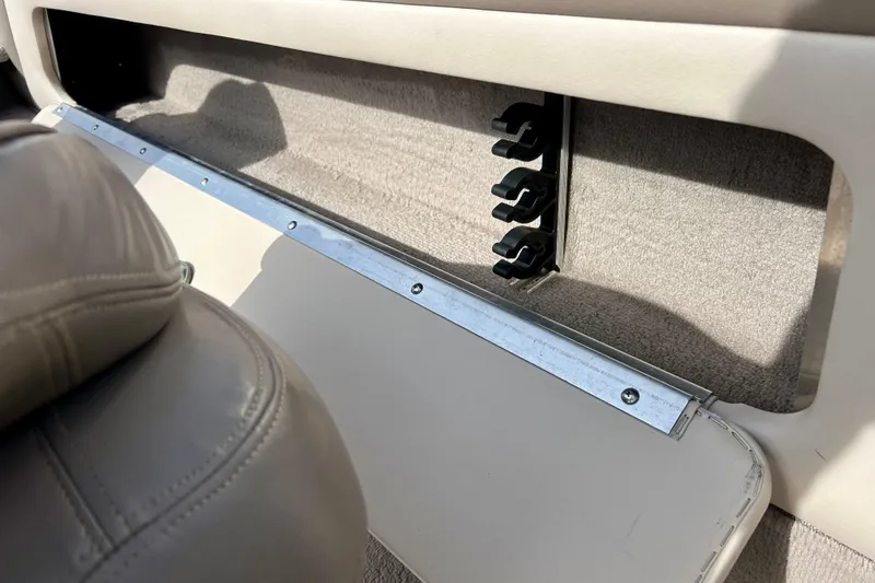 Slide: The Image of Interior view of a 2000 Lund 1850 Tyee Gran Sport boat, featuring storage compartment. - 30