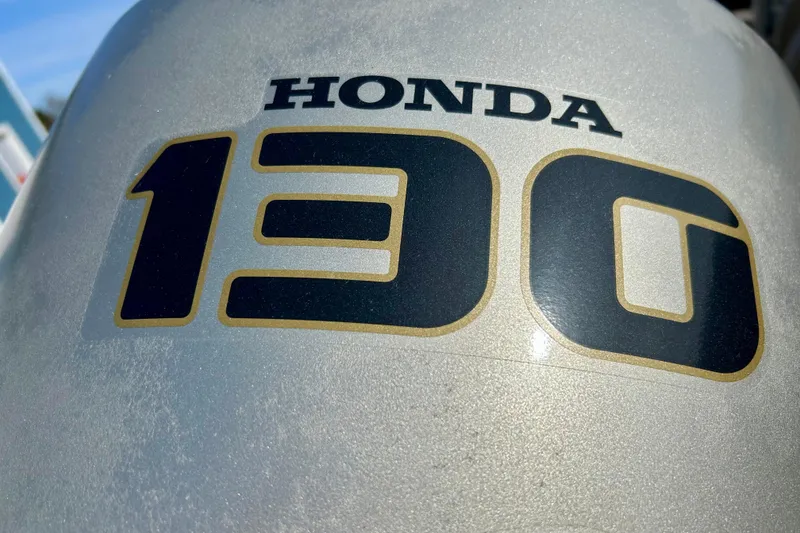 Slide: The Image of Honda 130 horsepower outboard motor on a 2000 Lund 1850 Tyee Gran Sport. - 36