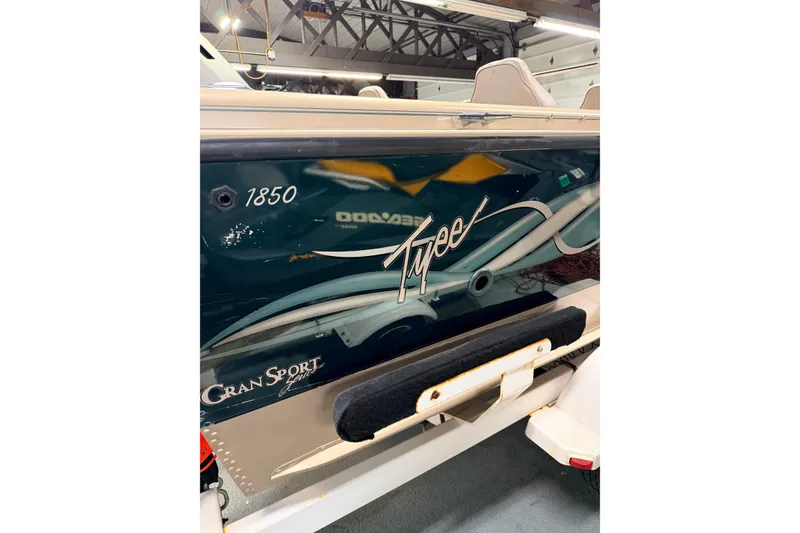 Slide: The Image of Gray boat seat on a 2000 Lund 1850 Tyee Gran Sport, with Honda 130 outboard motor. - 7